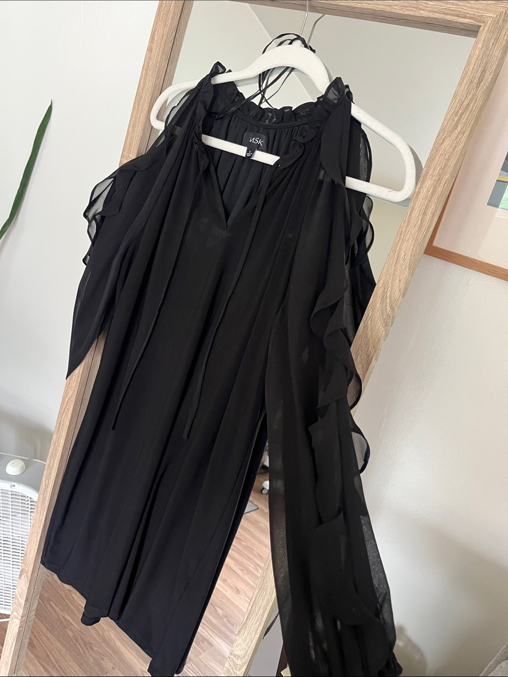 Black sleeveless ruffled top